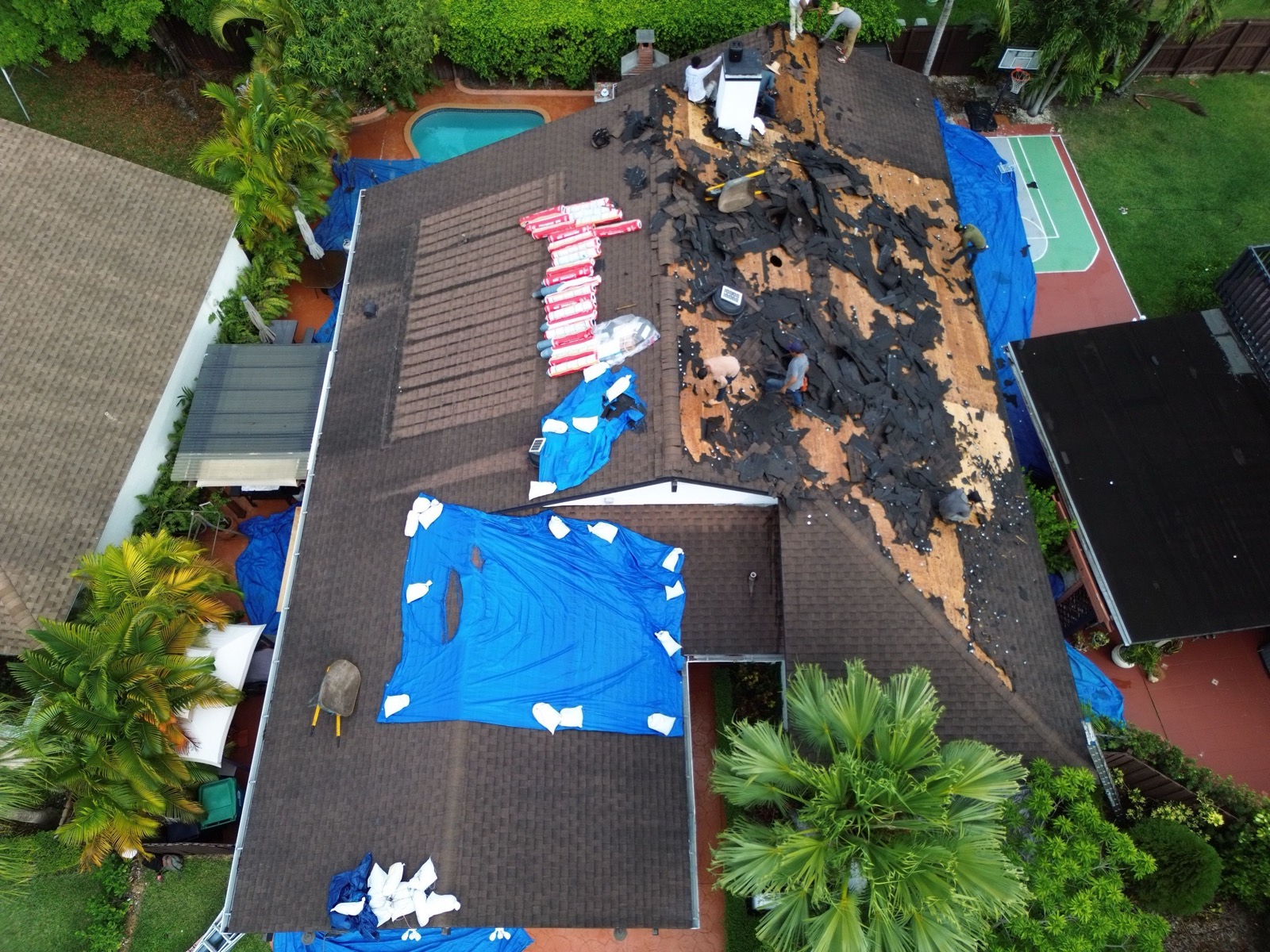 Old roof being stripped before replacement in Southwest Miami-Dade